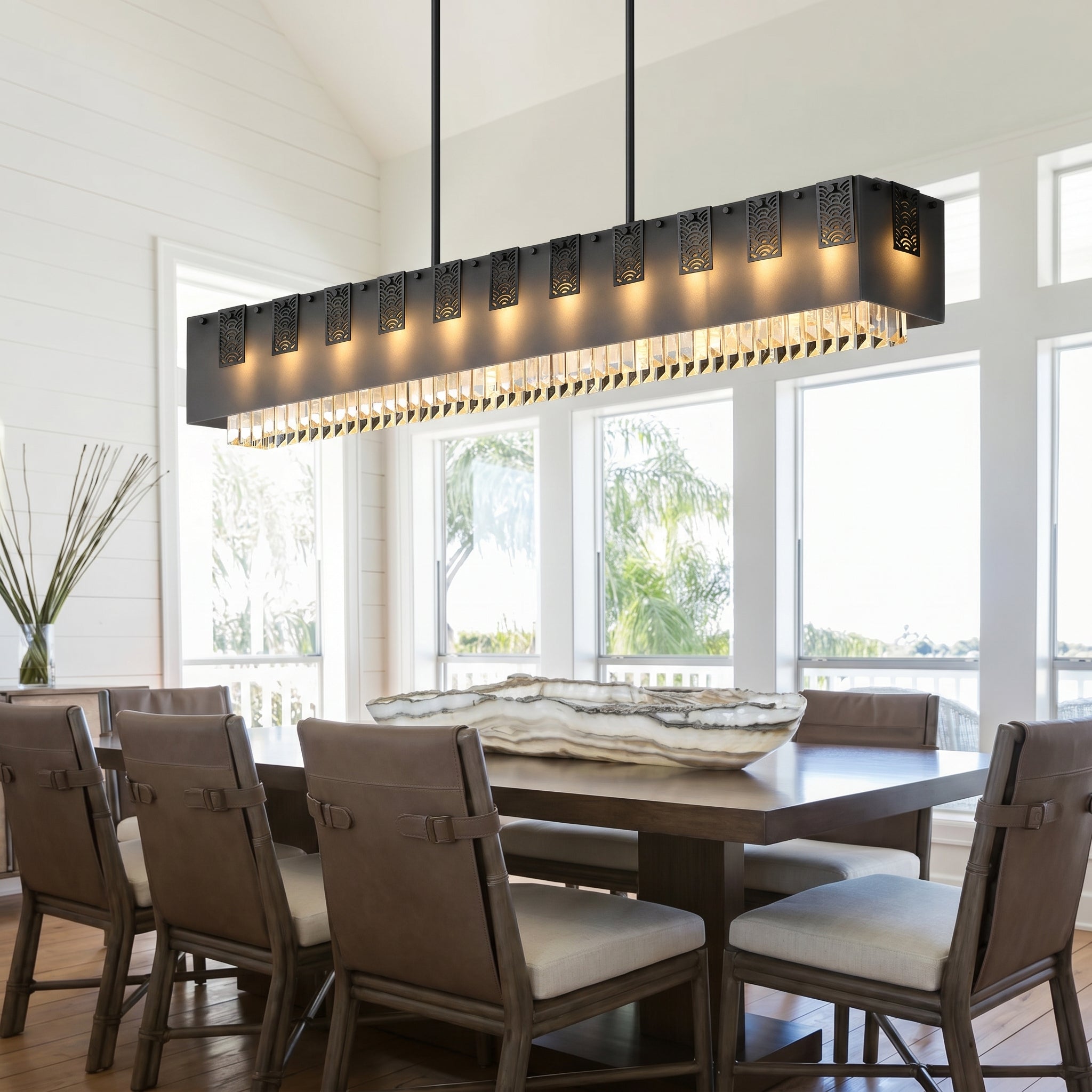 Cascata Brillante matte black crystal bar pendant over a long dining table