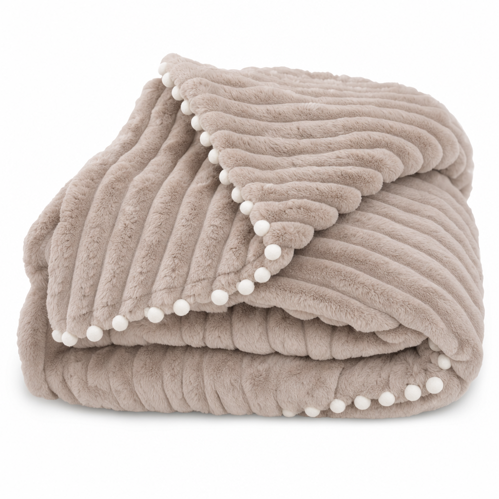 Piuma Reale reversible plush throw in light brown, folded on white showing the reverse