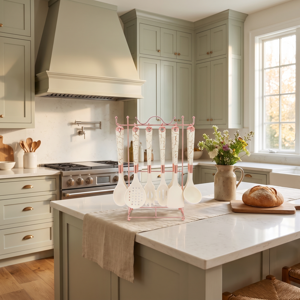 Cream white Marmo utensil set on its rose-gold stand in a sunlit sage-green farmhouse kitchen