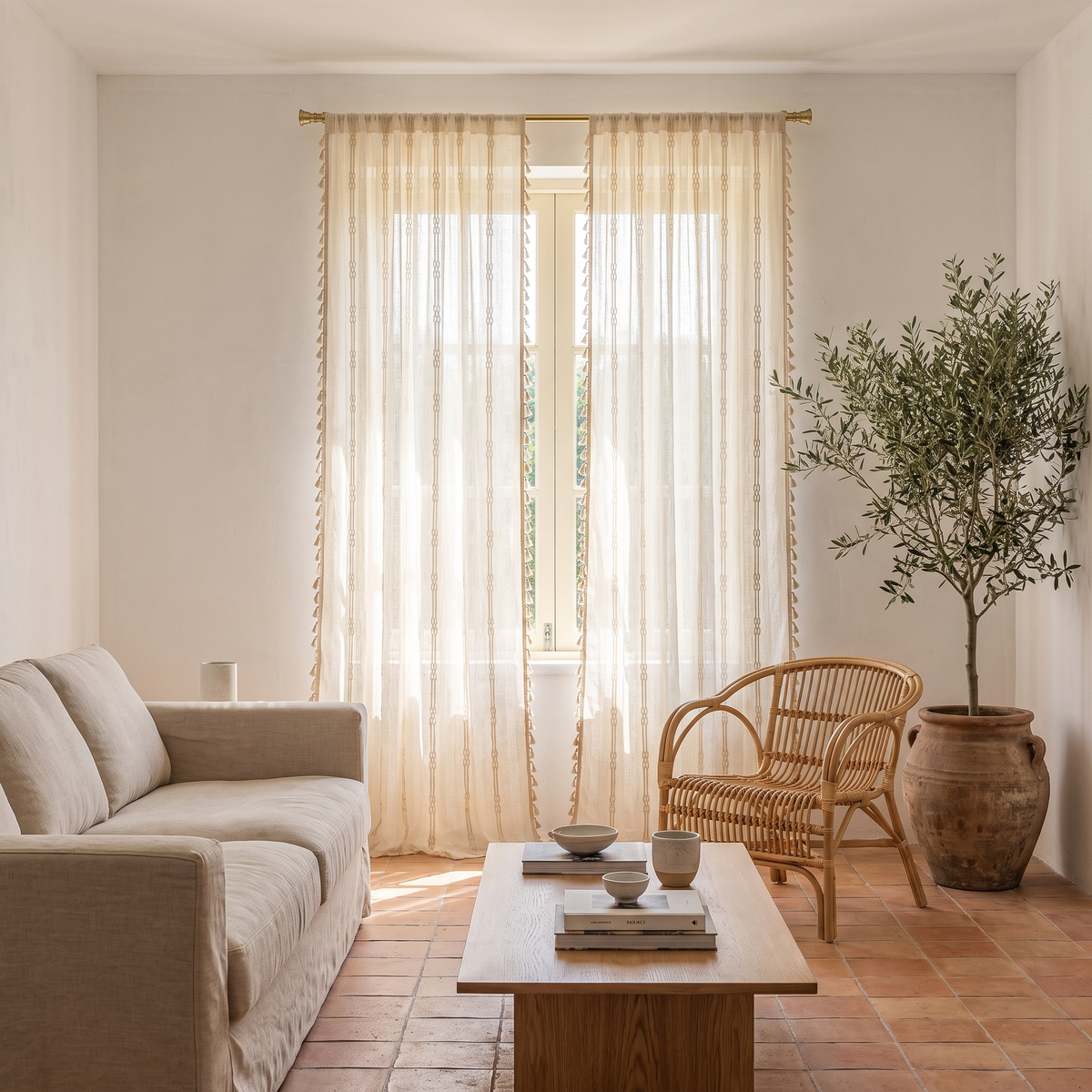 Brezza braided sheer tassel curtains in a sunlit Mediterranean living room