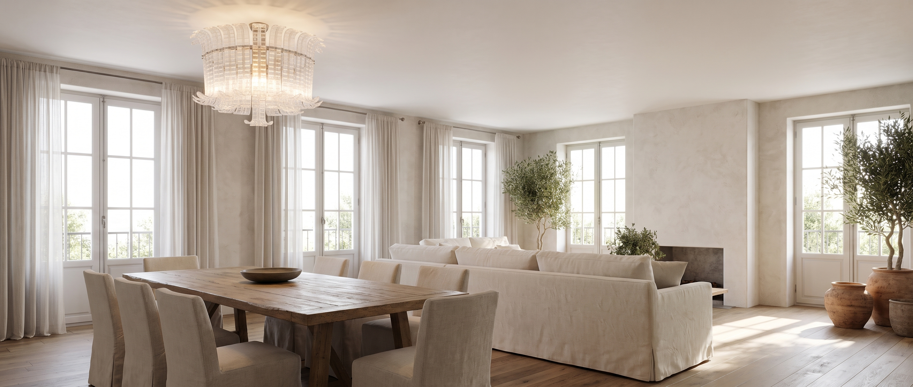 Fronda Veneziana clear glass flush mount above a dining table in a sunlit open-plan living room