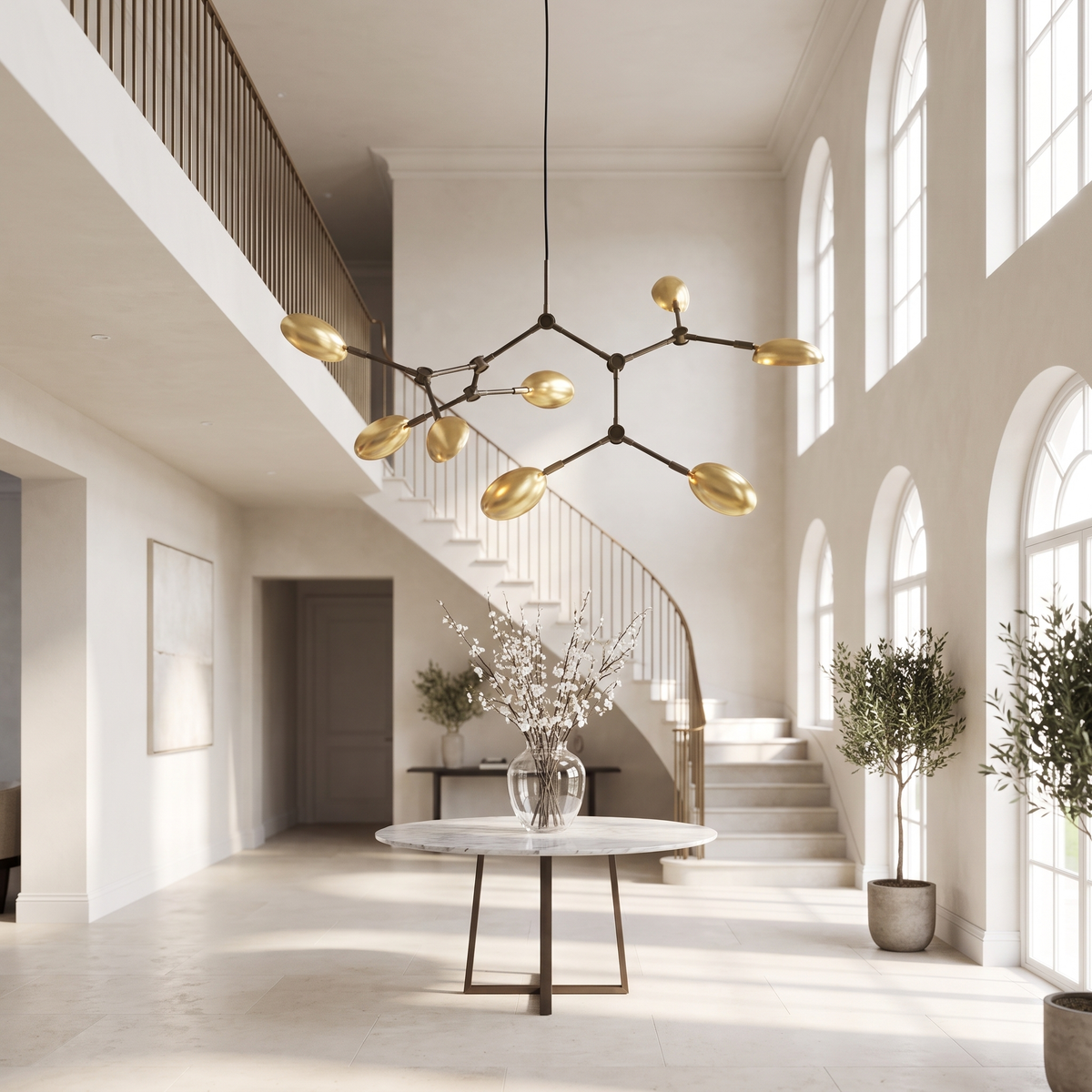 Ramo Goccia brass branch chandelier in a double-height entry foyer