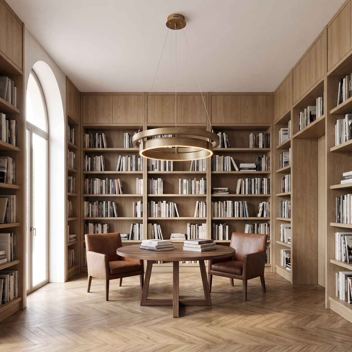 Small double ring chandelier over a round walnut reading table in a home library with oak bookshelves