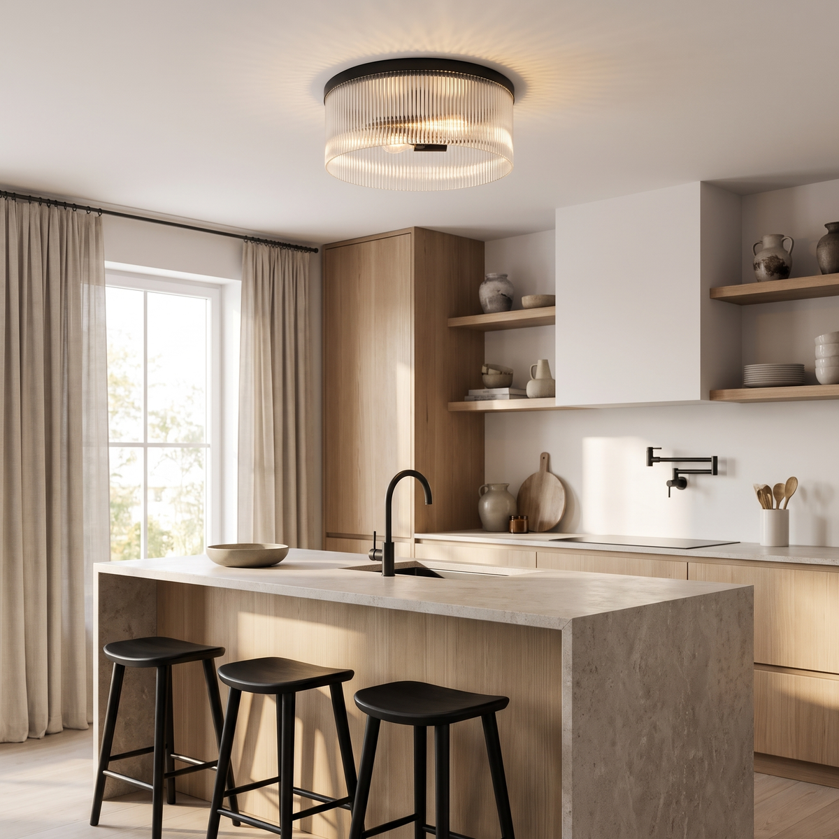 Black ribbed glass flush mount glowing above an oak kitchen island