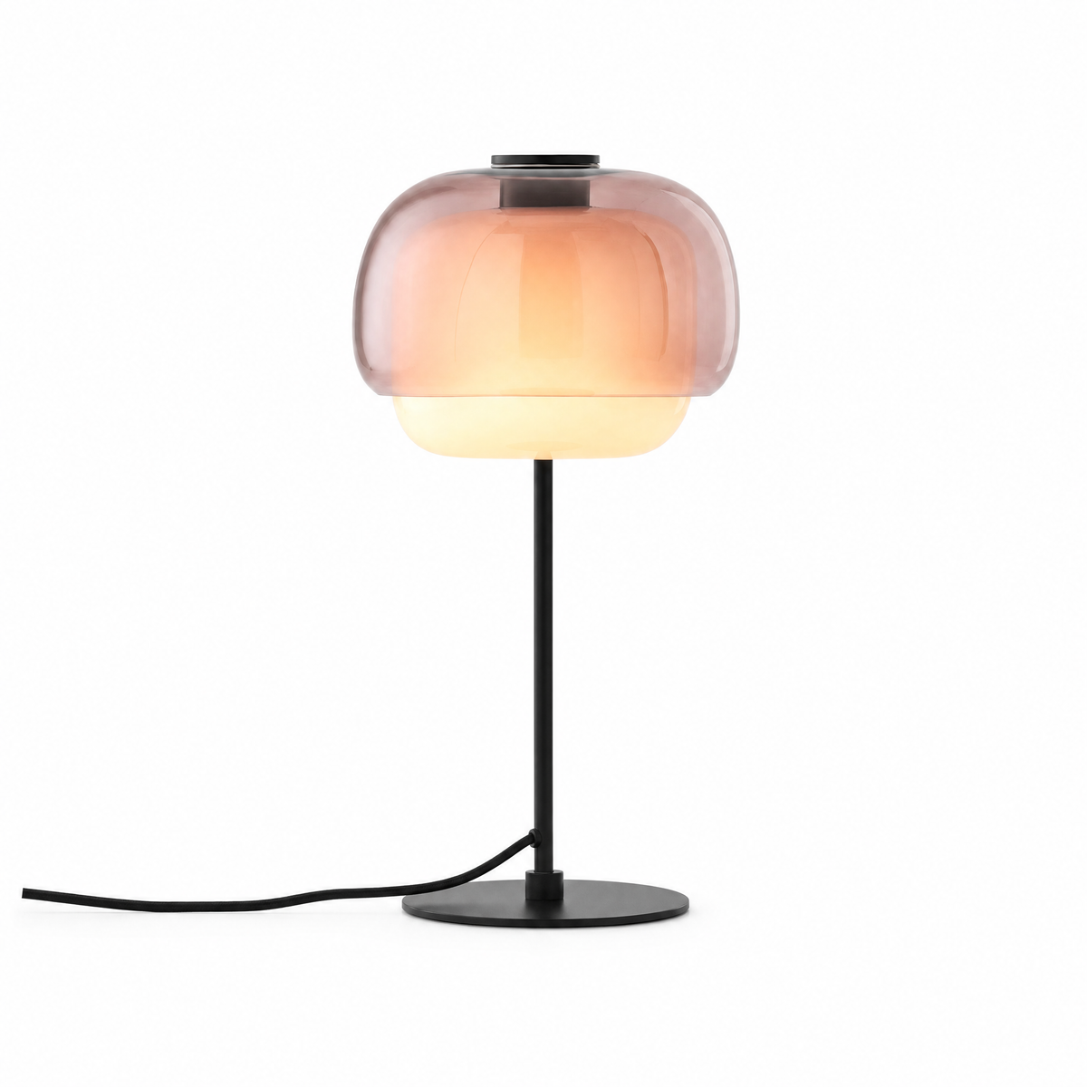 Doppio Bagliore double-dome glass table lamp in Blush, lit, on white
