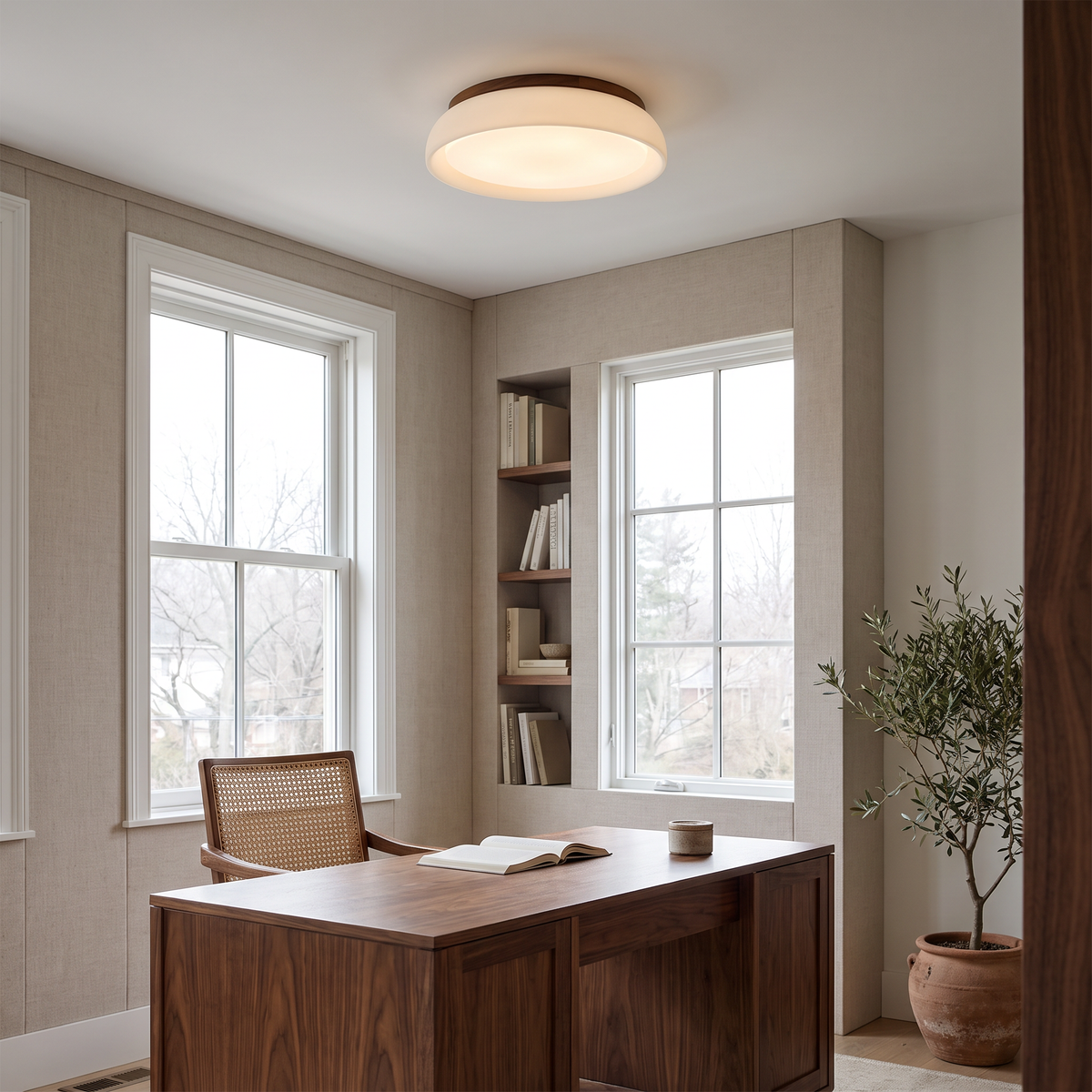 Frosted glass flush mount ceiling light in a home office with a walnut desk