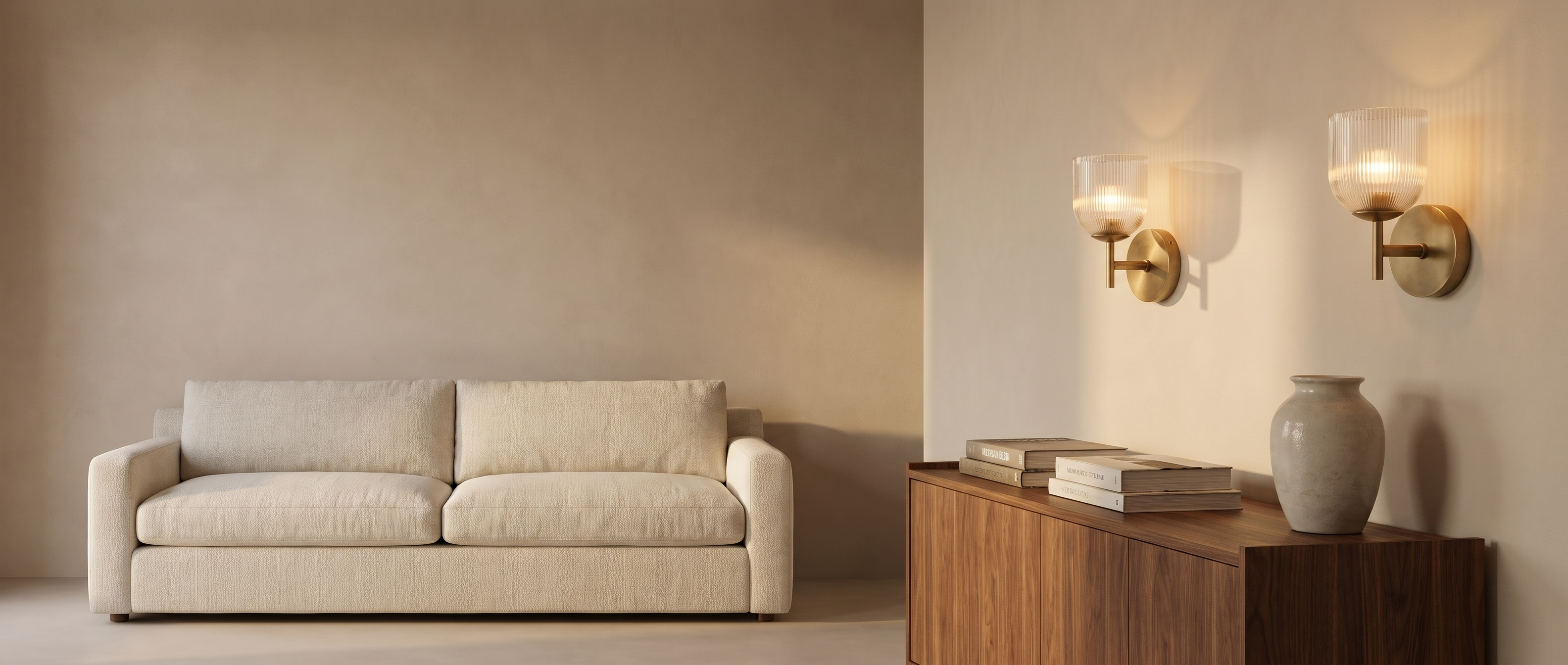 Pair of brass ribbed glass wall sconces above a walnut console in a warm Italian living room