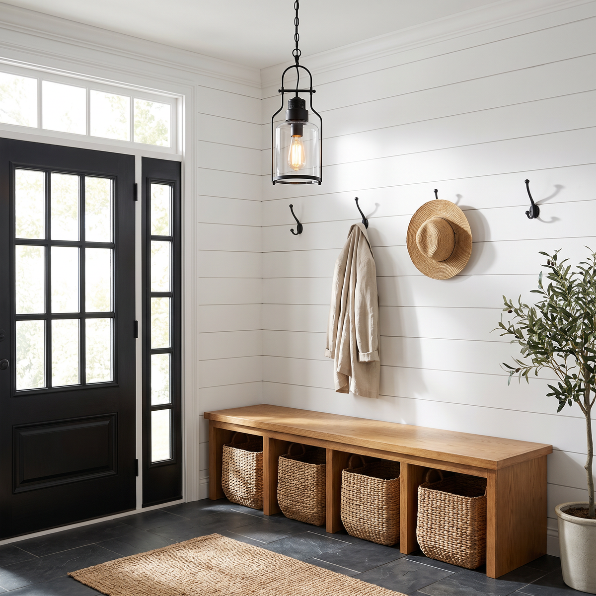 Black glass jar pendant in a farmhouse mudroom entry