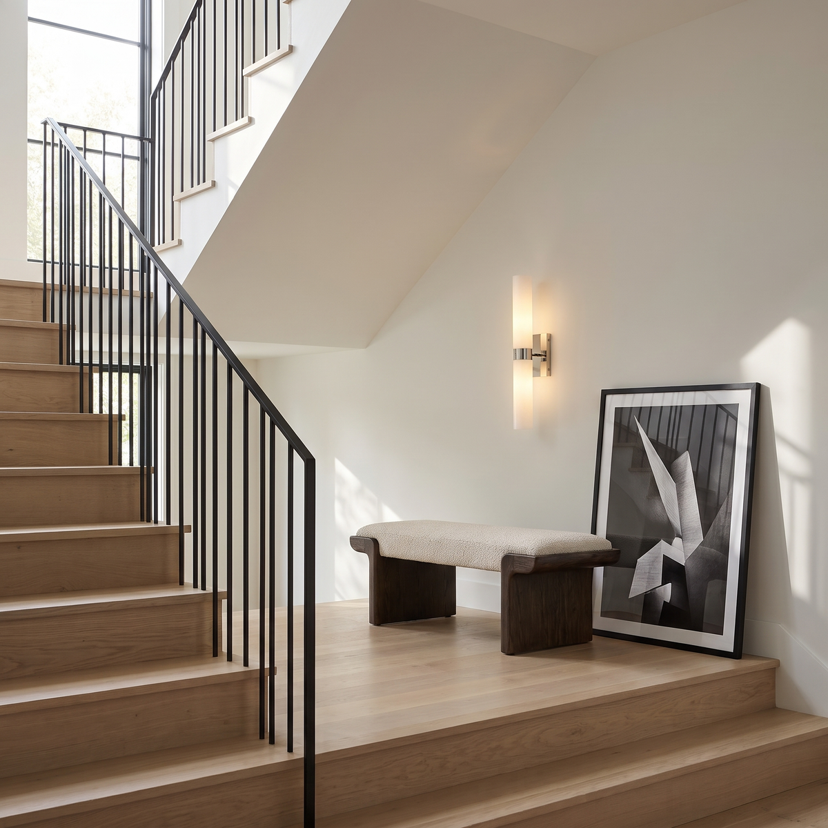 Frosted glass tube sconce in polished nickel lighting a white oak stair landing
