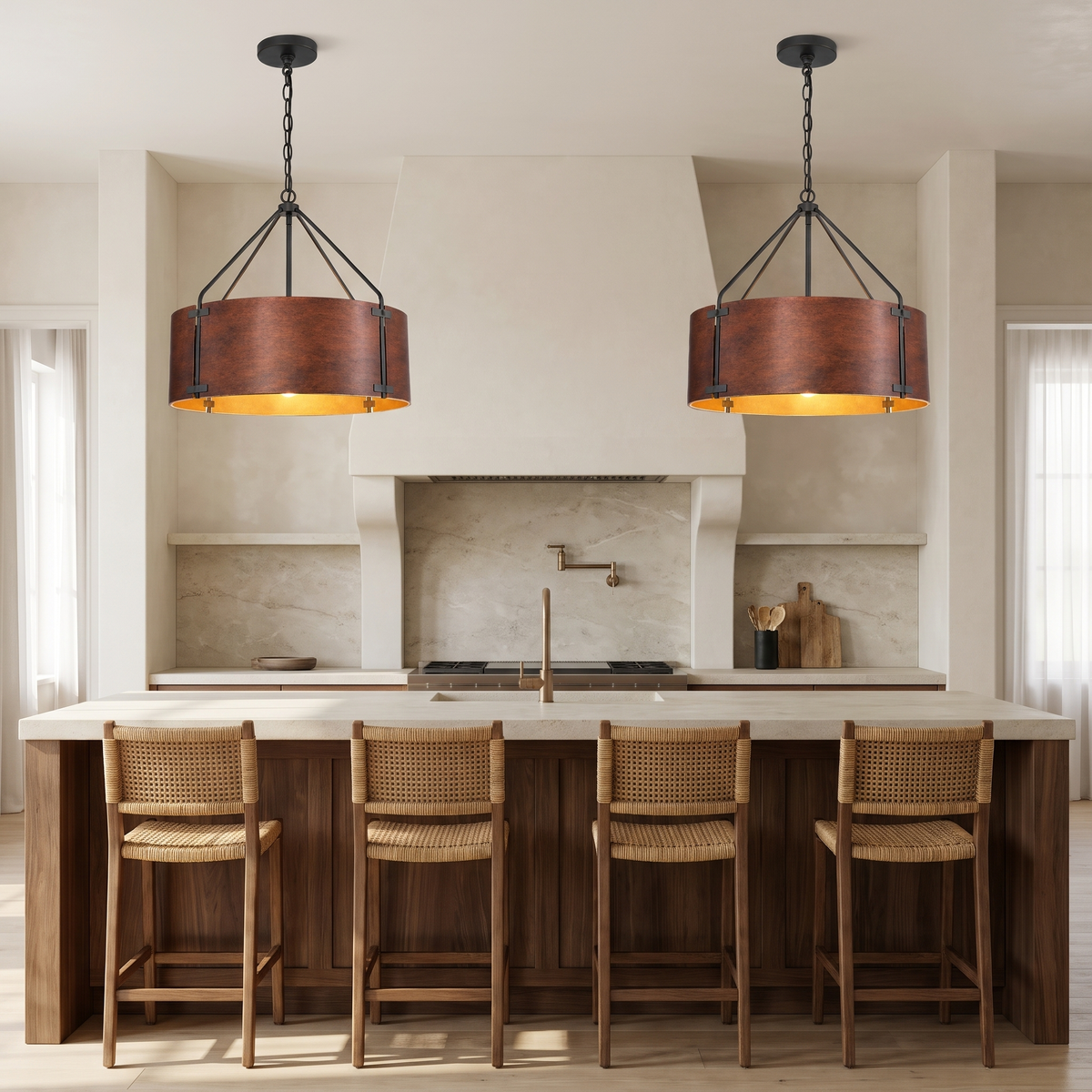 Two small Tamburo bronze drum chandeliers over a walnut kitchen island
