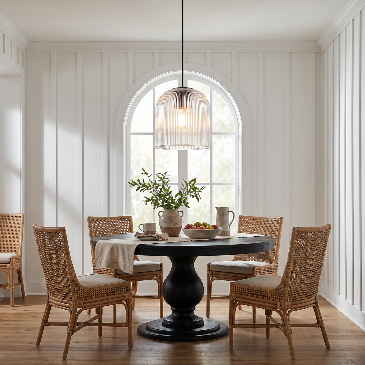 Rigata 14 in black ribbed glass dome pendant over a round dining table