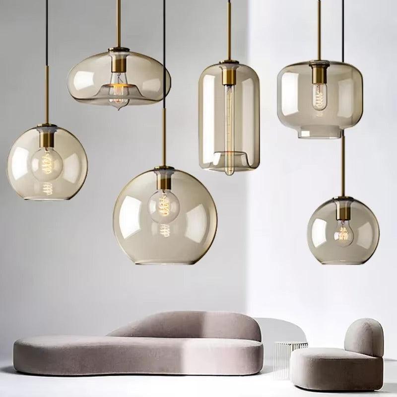 Cluster of Ambra cognac glass pendants above a curved sofa