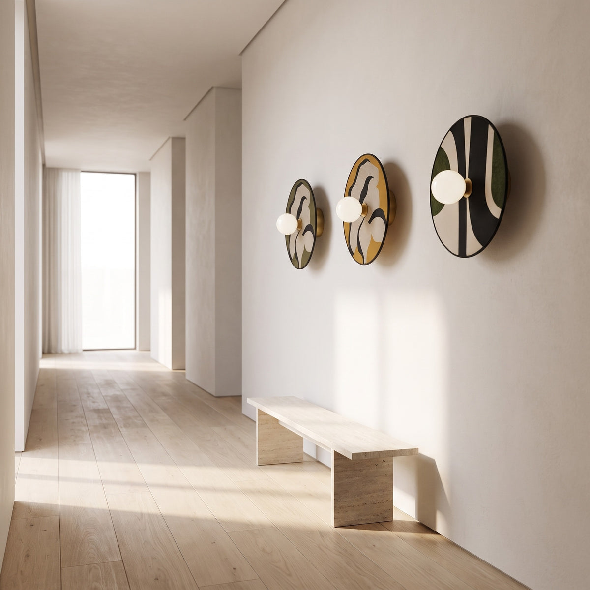 Luna Tessuta wall sconces in Khaki Bloom, Ochre Bloom and Forest Stripe along a gallery hallway