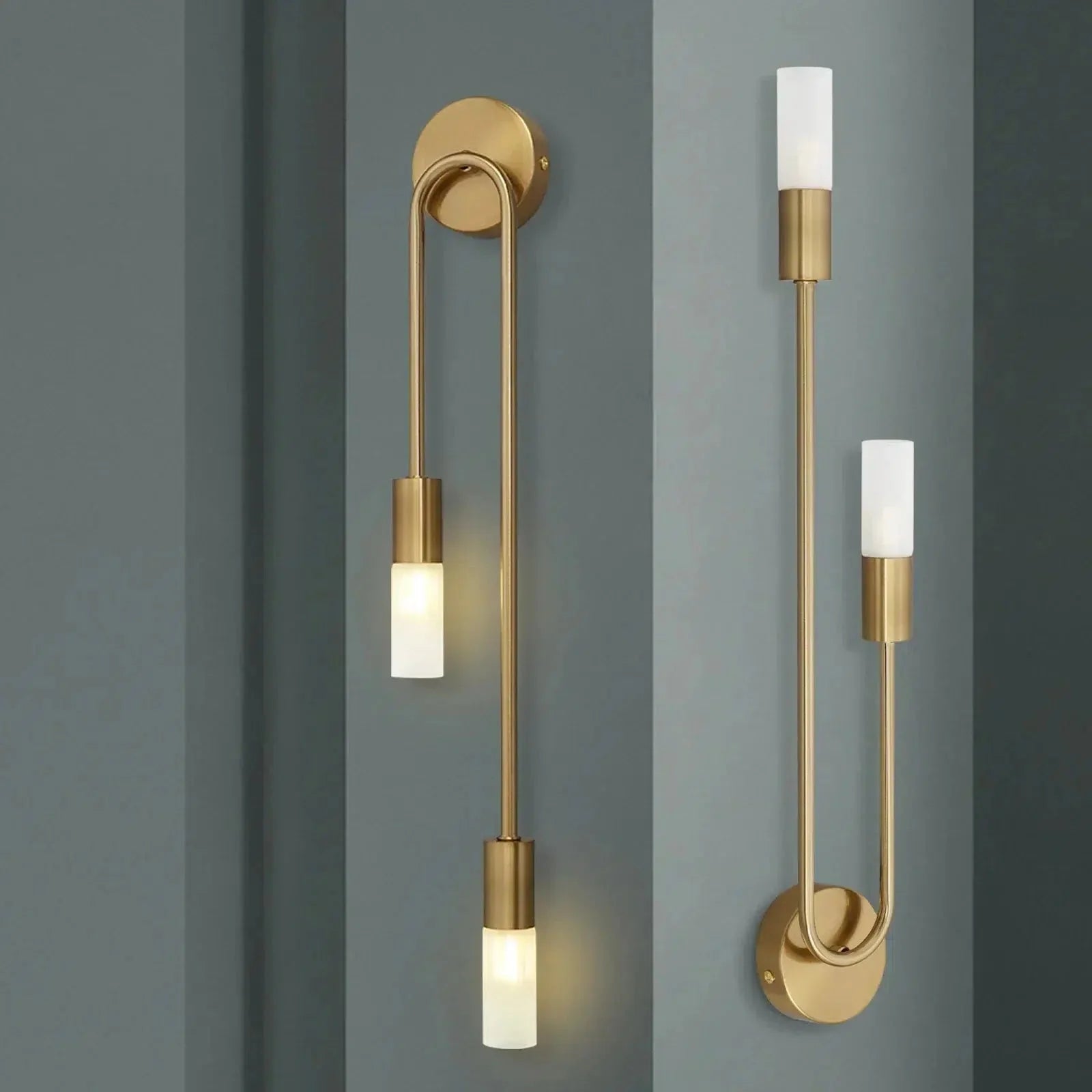 Gold curved wall sconces, left-facing and right-facing