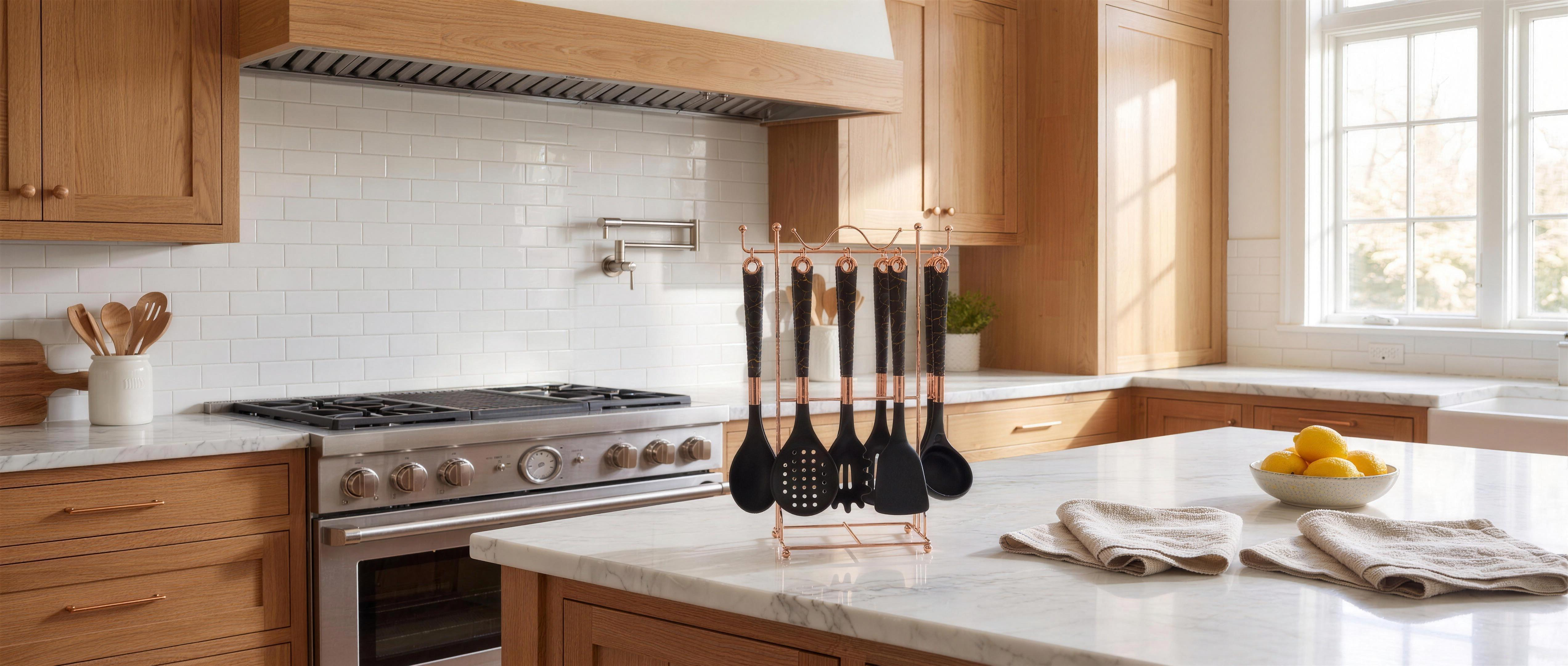 Black Marmo utensil set on its rose-gold stand in a bright oak kitchen, wide banner