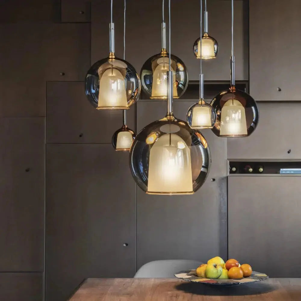 Luna Glass Globe Pendants clustered over a dining table