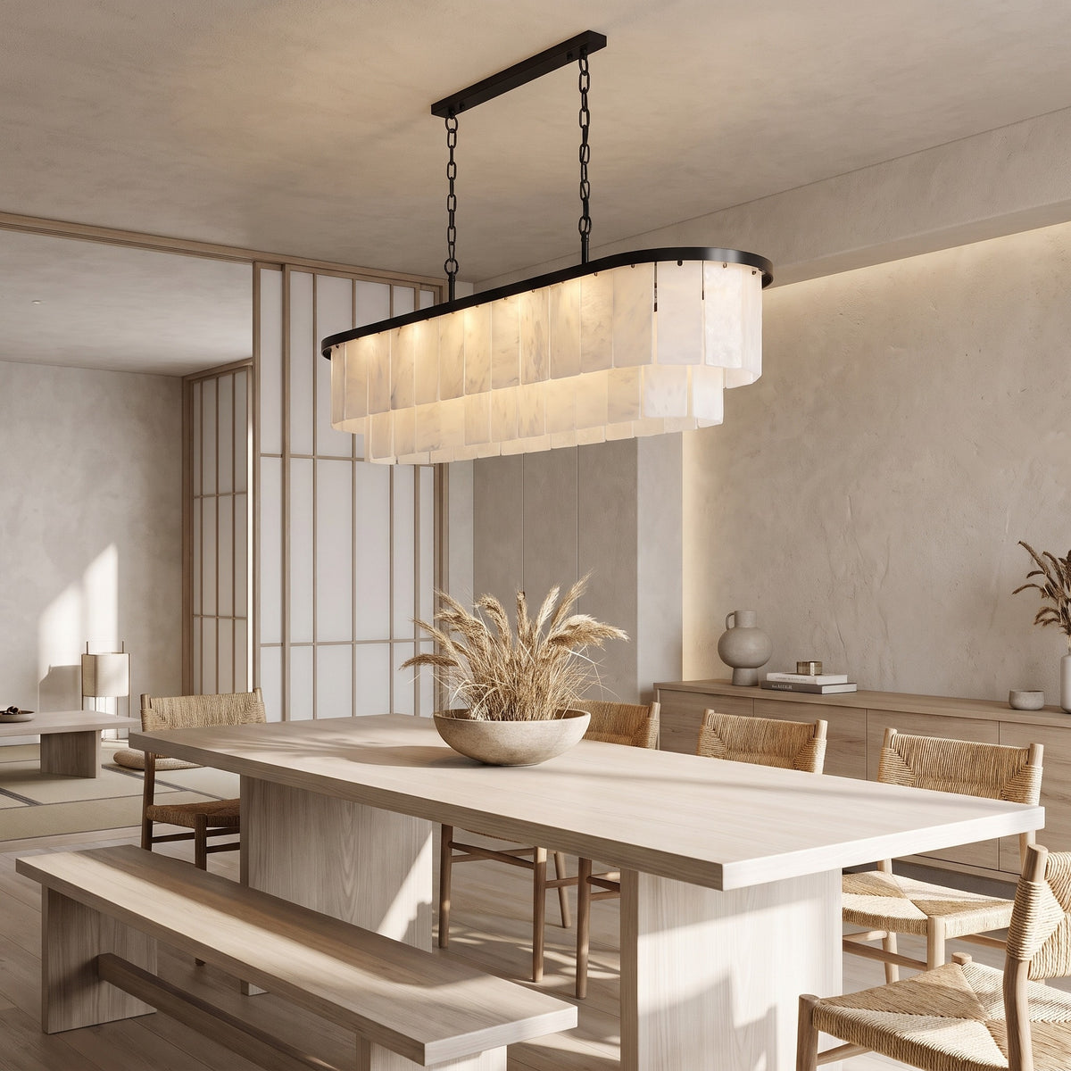 Velo Alabastro alabaster chandelier over an ash dining table with a bench in a Japandi dining room