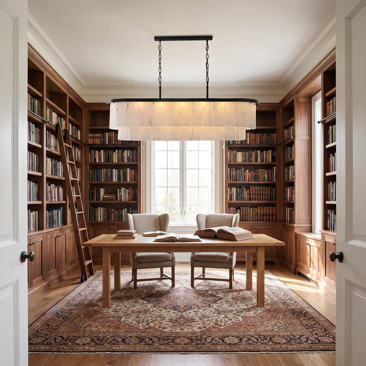 Velo Alabastro linear chandelier above a reading table in a walnut-shelved home library
