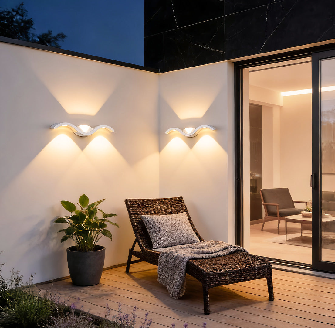 https://cdn.shopify.com/s/files/1/0556/5382/6742/files/wave-wall-sconce-backyard-ambient-light.jpg?v=1767081429