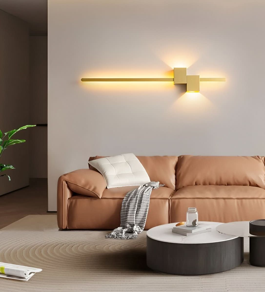 Gold linear LED wall light with warm indirect glow