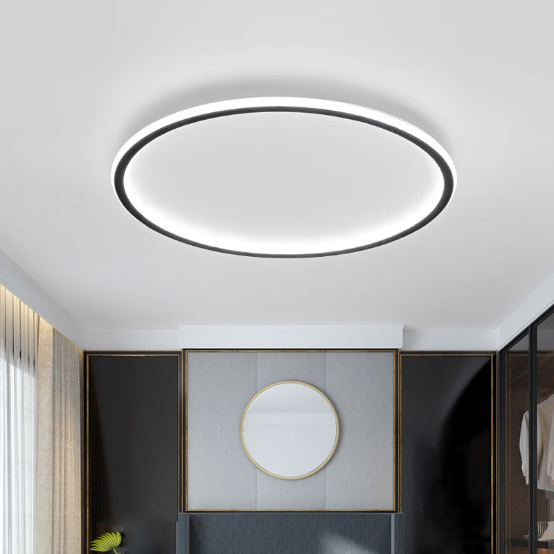 Luce Aurora white halo ceiling light in a refined bedroom