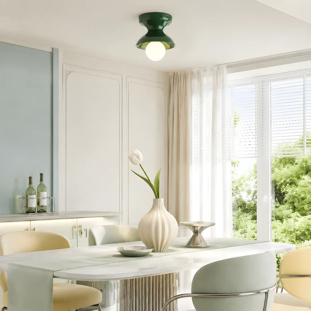 Juniper green ceramic flush mount ceiling light above a dining table