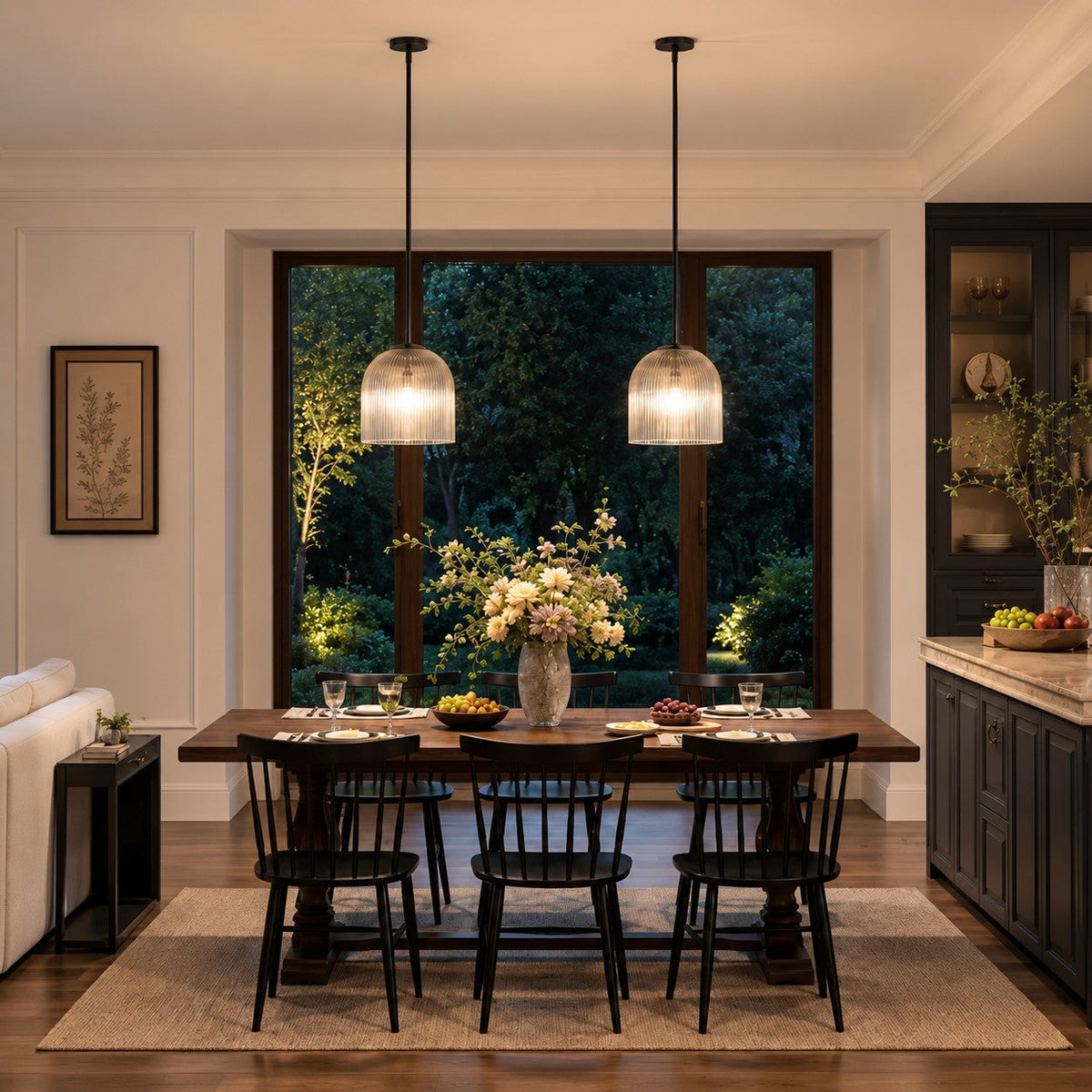 Pair of black Rigata ribbed glass pendants over a dark wood dining table
