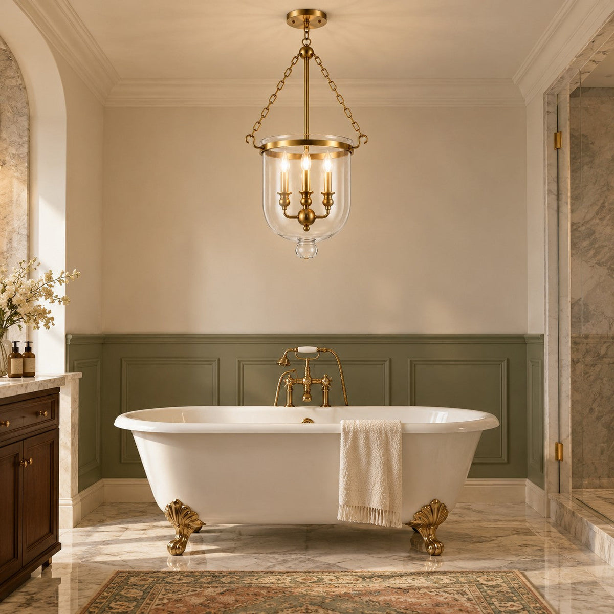 Brass bell jar pendant above a clawfoot bathtub