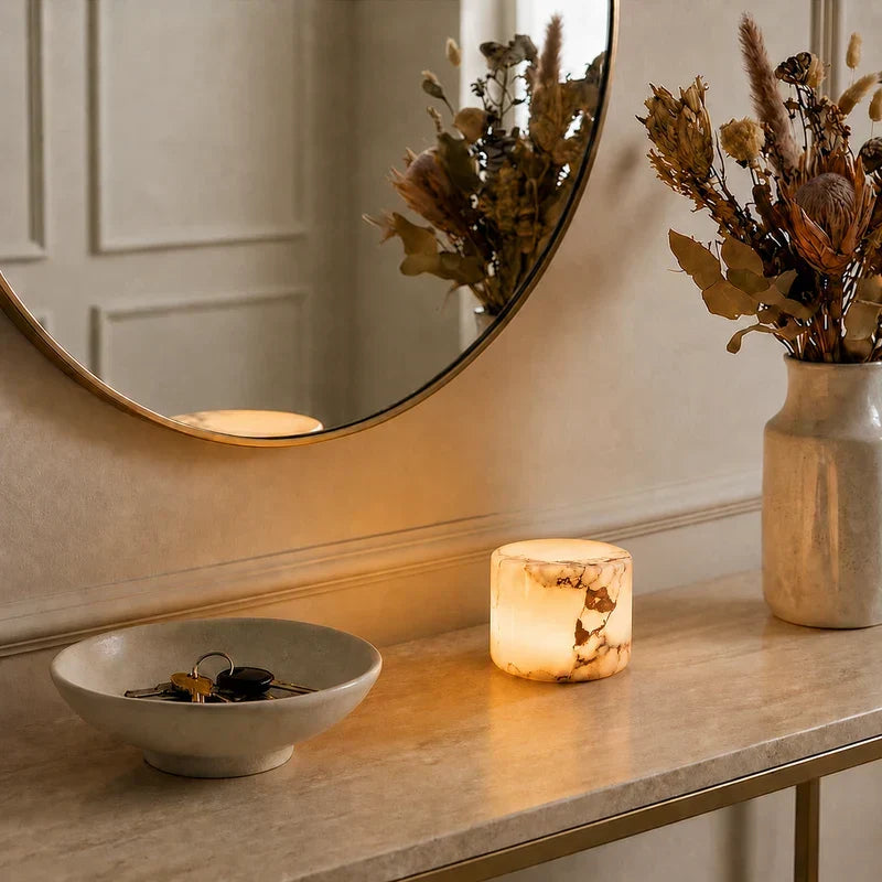 Pietra Lunare marble lamp on an entryway console with mirror and dried flowers