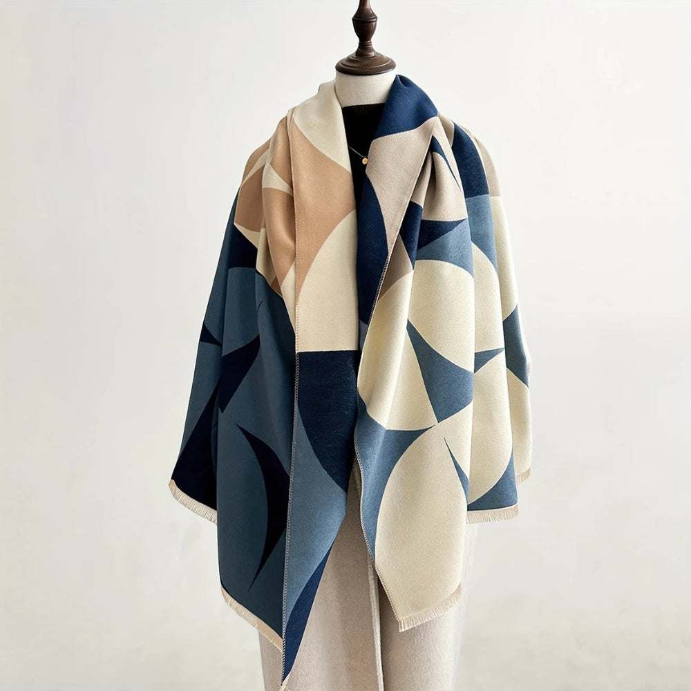 Woman wearing Autumn Blue reversible geometric wrap poncho