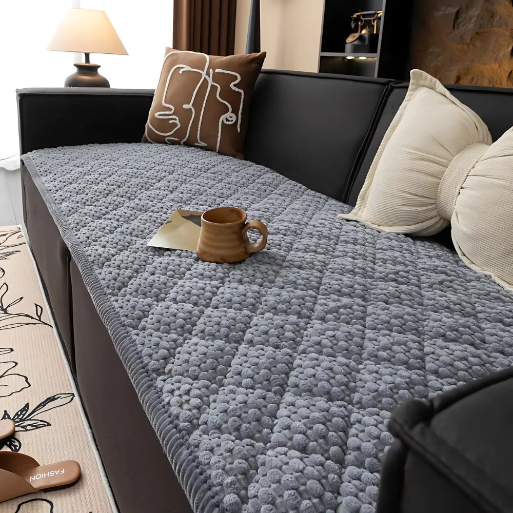 https://cdn.shopify.com/s/files/1/0637/4480/2863/files/Pet-ProofTexturedQuiltedSofaProtectorSlipcover_2.jpg?v=1755331399