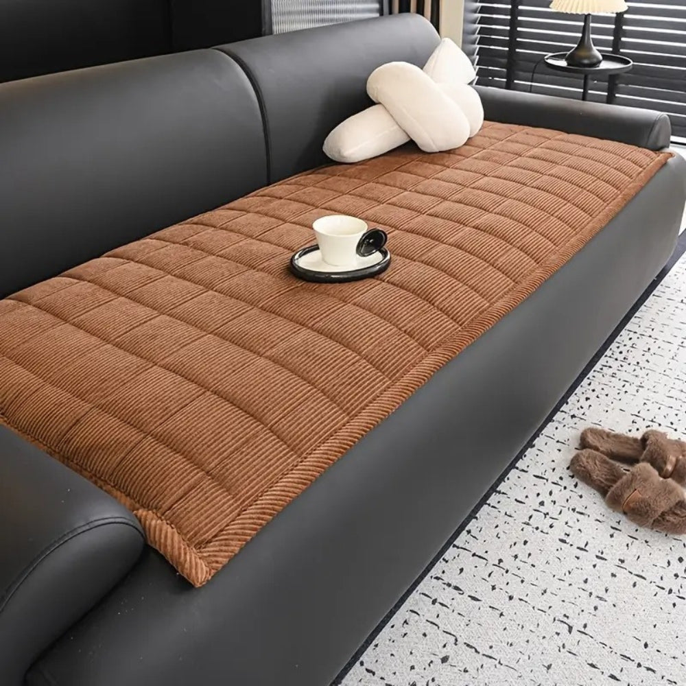 https://cdn.shopify.com/s/files/1/0637/4480/2863/files/QuiltedModernSofaCover_1_53c930e7-05f0-4d64-bc65-3cd5fde1b3b9.jpg?v=1757056920