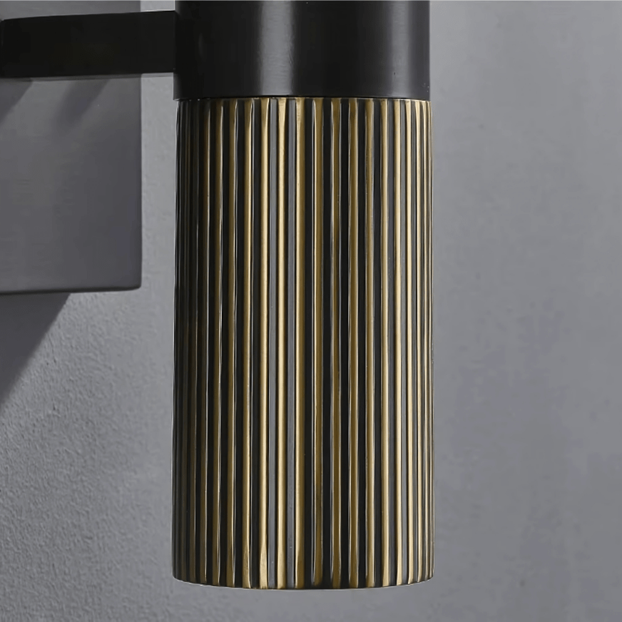 Detail of the fluted antique-brass column of the Aurora Wall Sconce