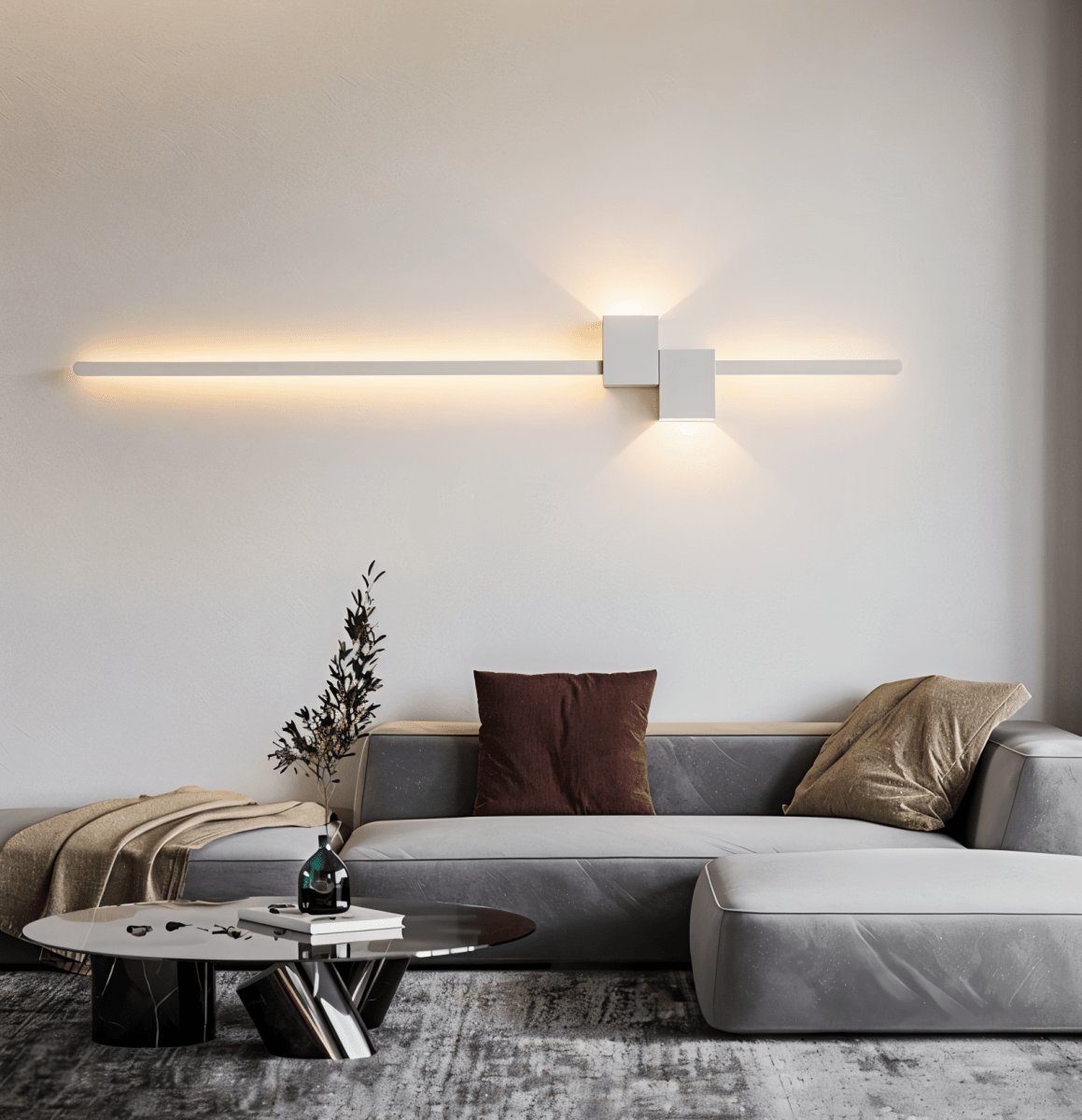 White linear LED wall light above a sofa, warm indirect glow