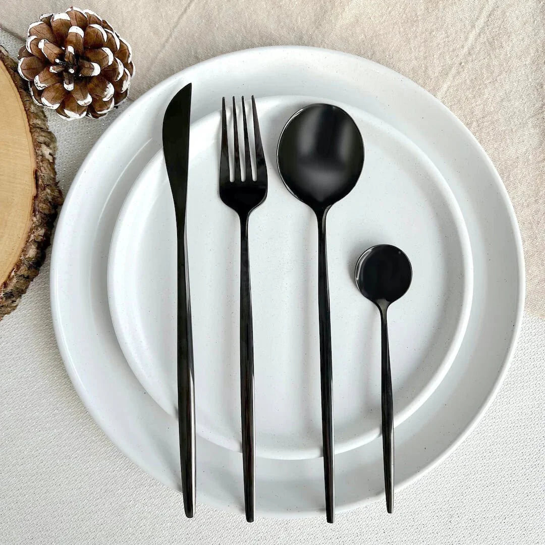 https://cdn.shopify.com/s/files/1/0655/0464/1076/files/black-modern-flatware-24pc-set-302081.webp?v=1773243013