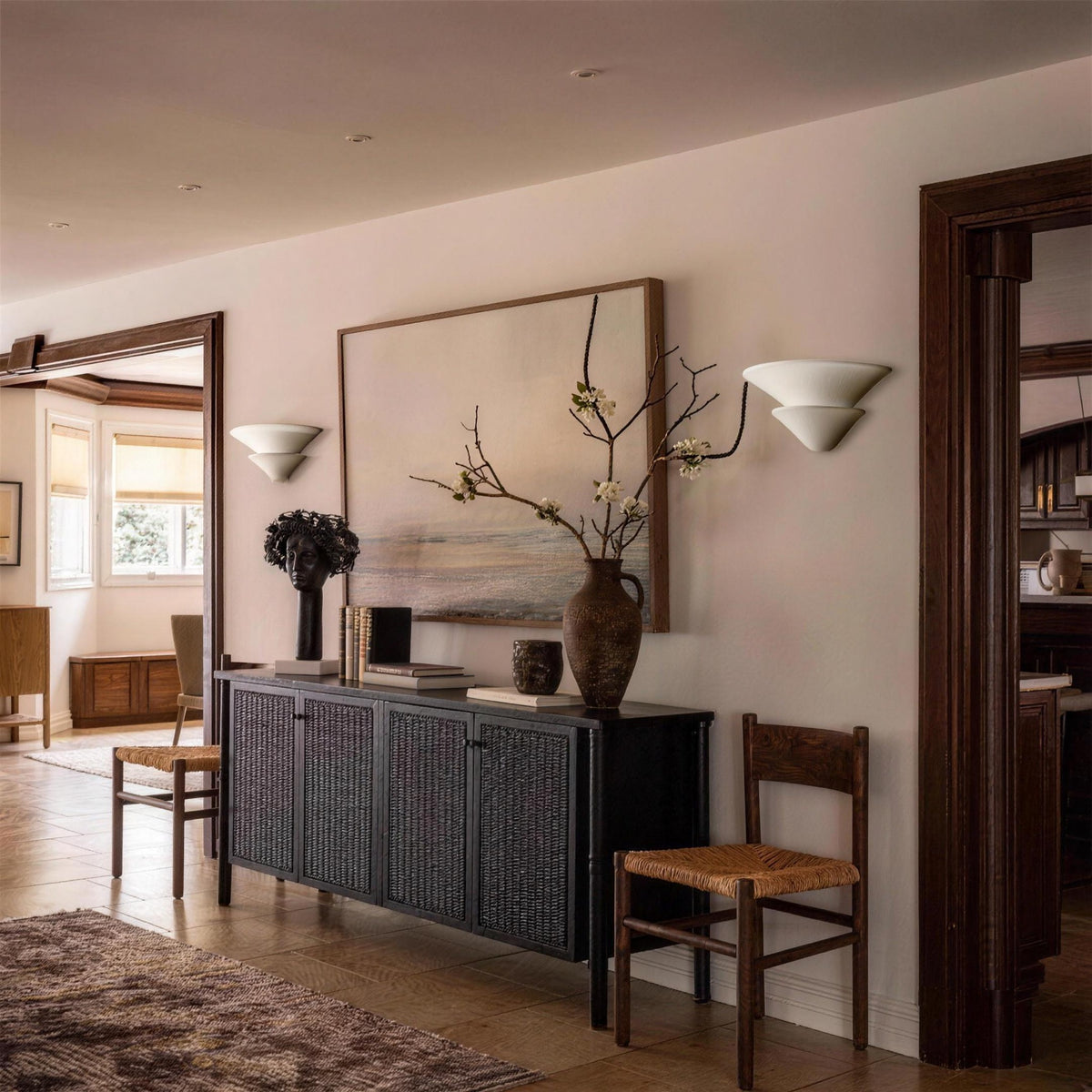 Pair of Coppa Serena alabaster wall sconces above an entryway console