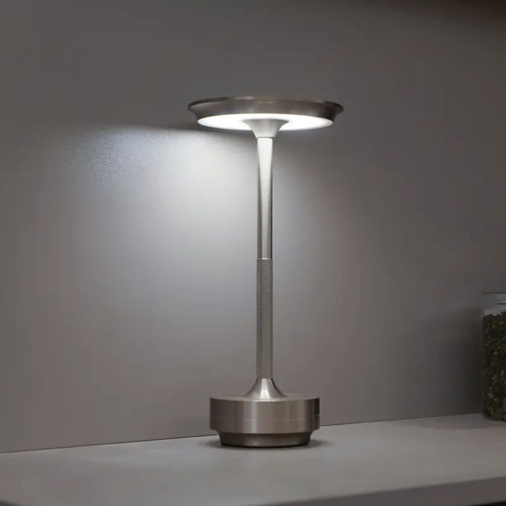 https://cdn.shopify.com/s/files/1/0655/0464/1076/files/cordless-table-lamp-3-mode-touch-sensitive-lattea-silver-on-the-shelf.jpg?v=1758222401