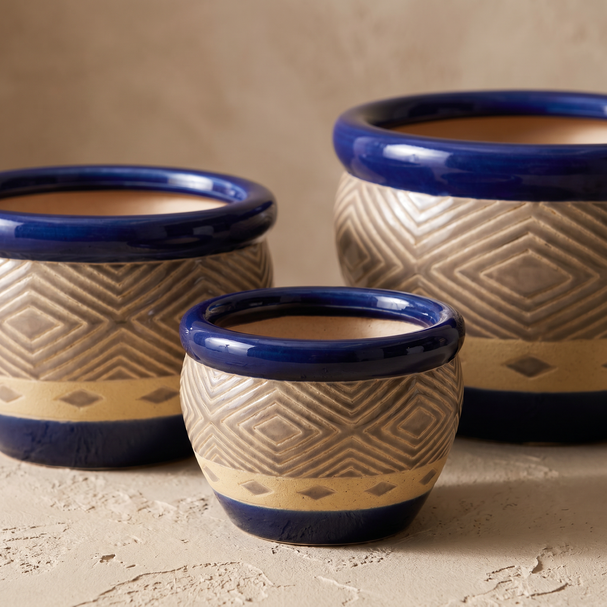 Close-up detail of cobalt blue ceramic planter glaze and hand-painted motif