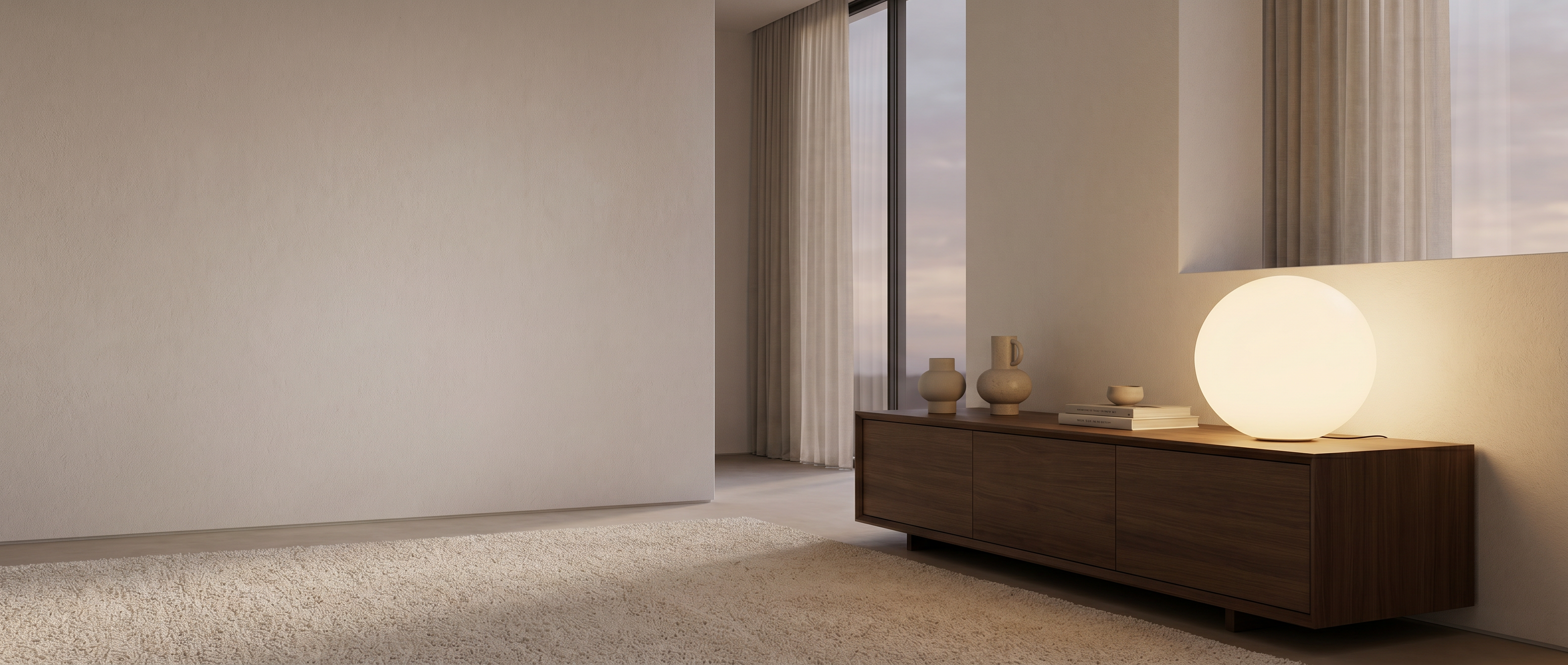 Sfera Lunare opal glass table lamp glowing on a console in a modern living space