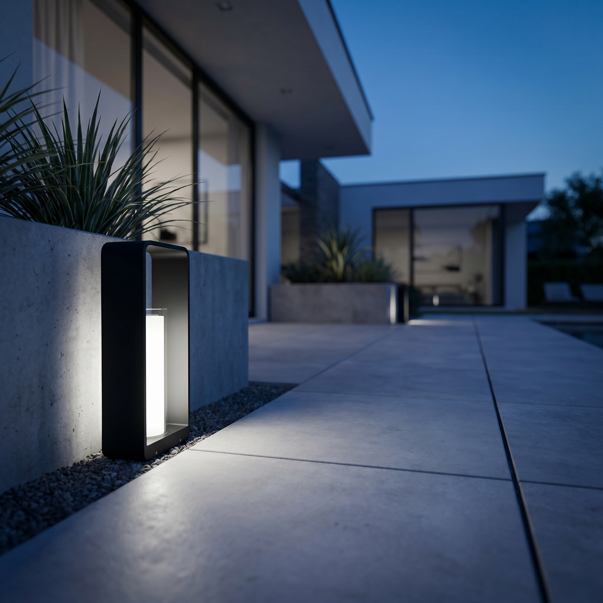 Cornice Lumina outdoor LED landscape light with cool-white glow on a modern patio at twilight