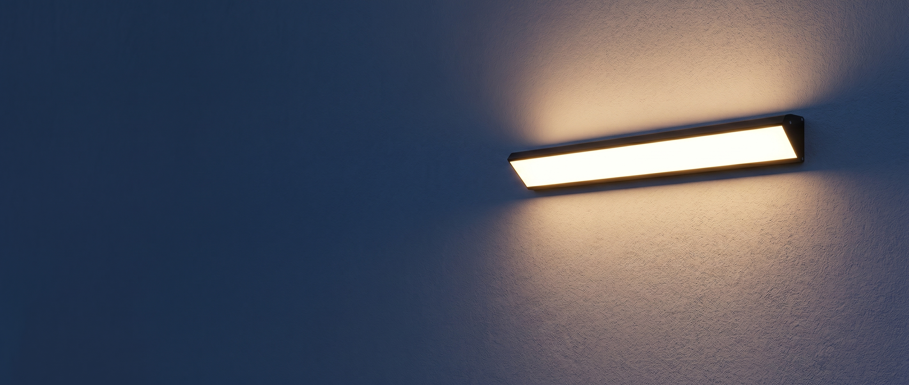 Sentinella Outdoor LED Wall Light banner — warm-lit fixture on exterior wall at dusk