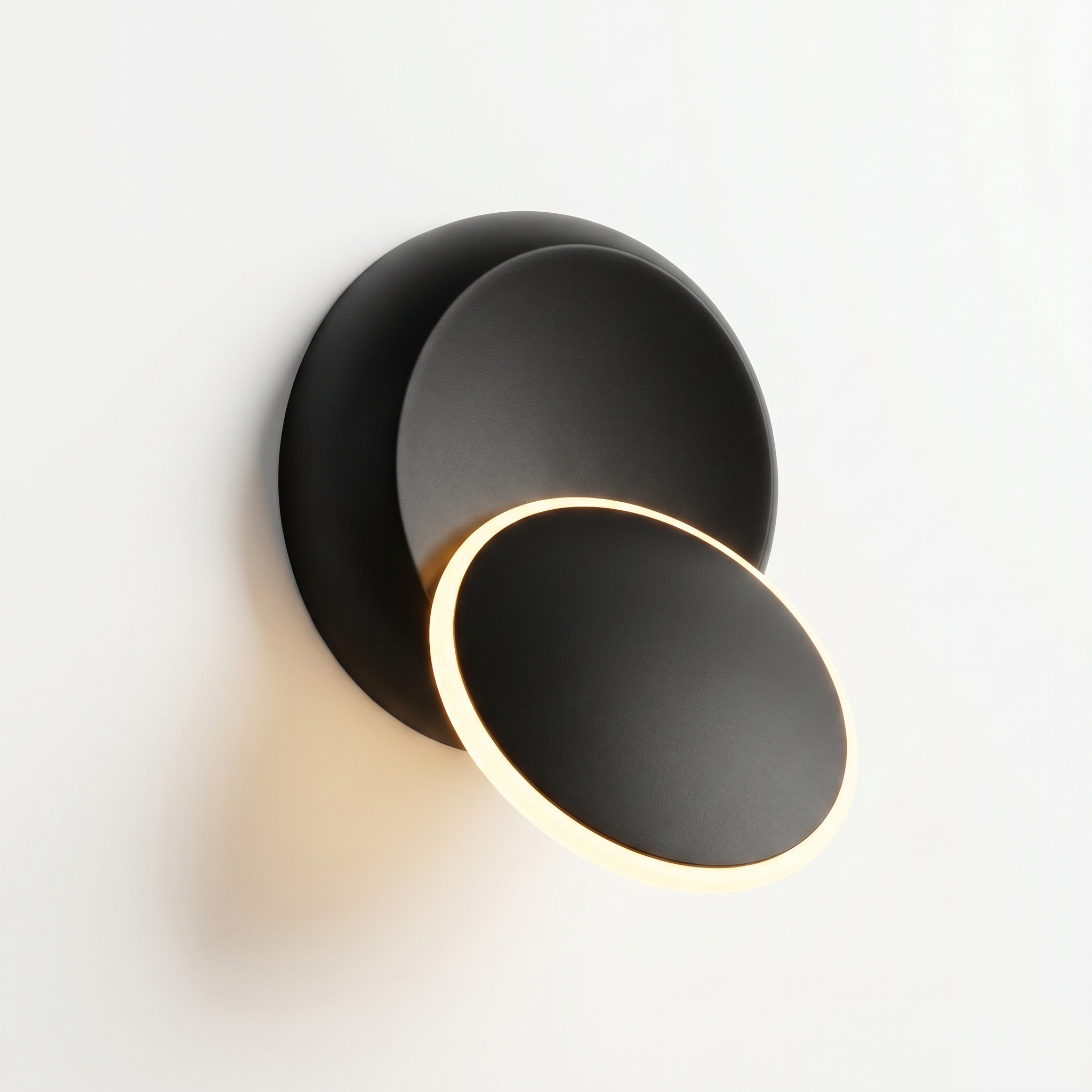 Luna Piena rotating wall sconce — Black with warm white glow