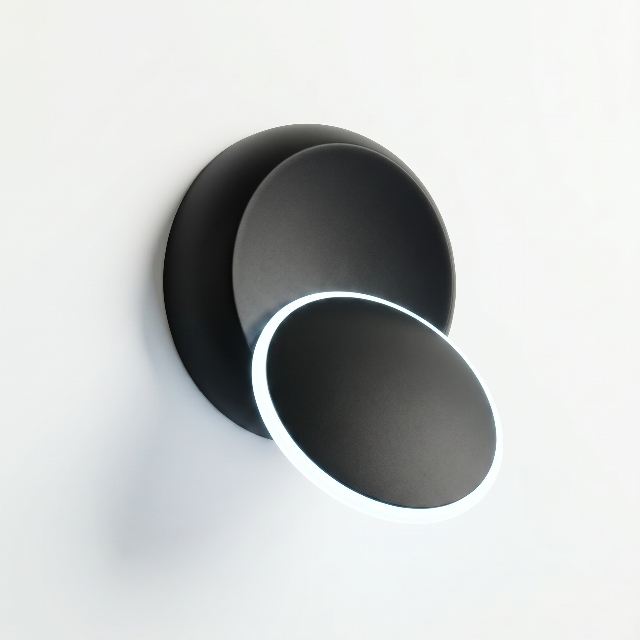 Luna Piena rotating wall sconce — Black with cool white glow