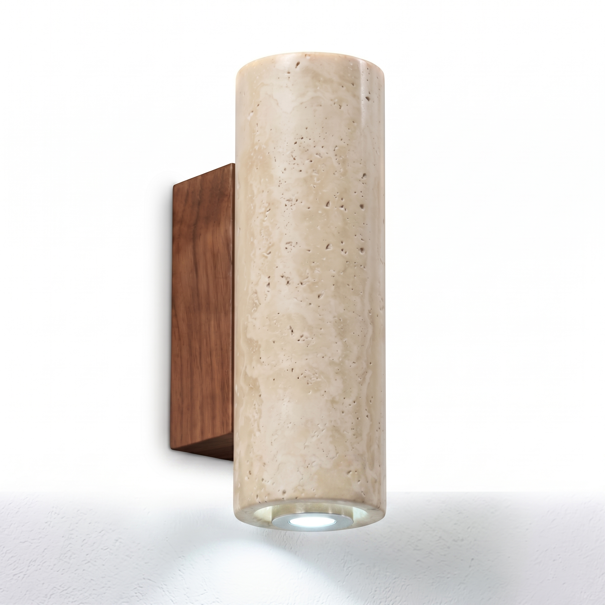 Luce di Pietra travertine wall sconce with cool white glow on a white background