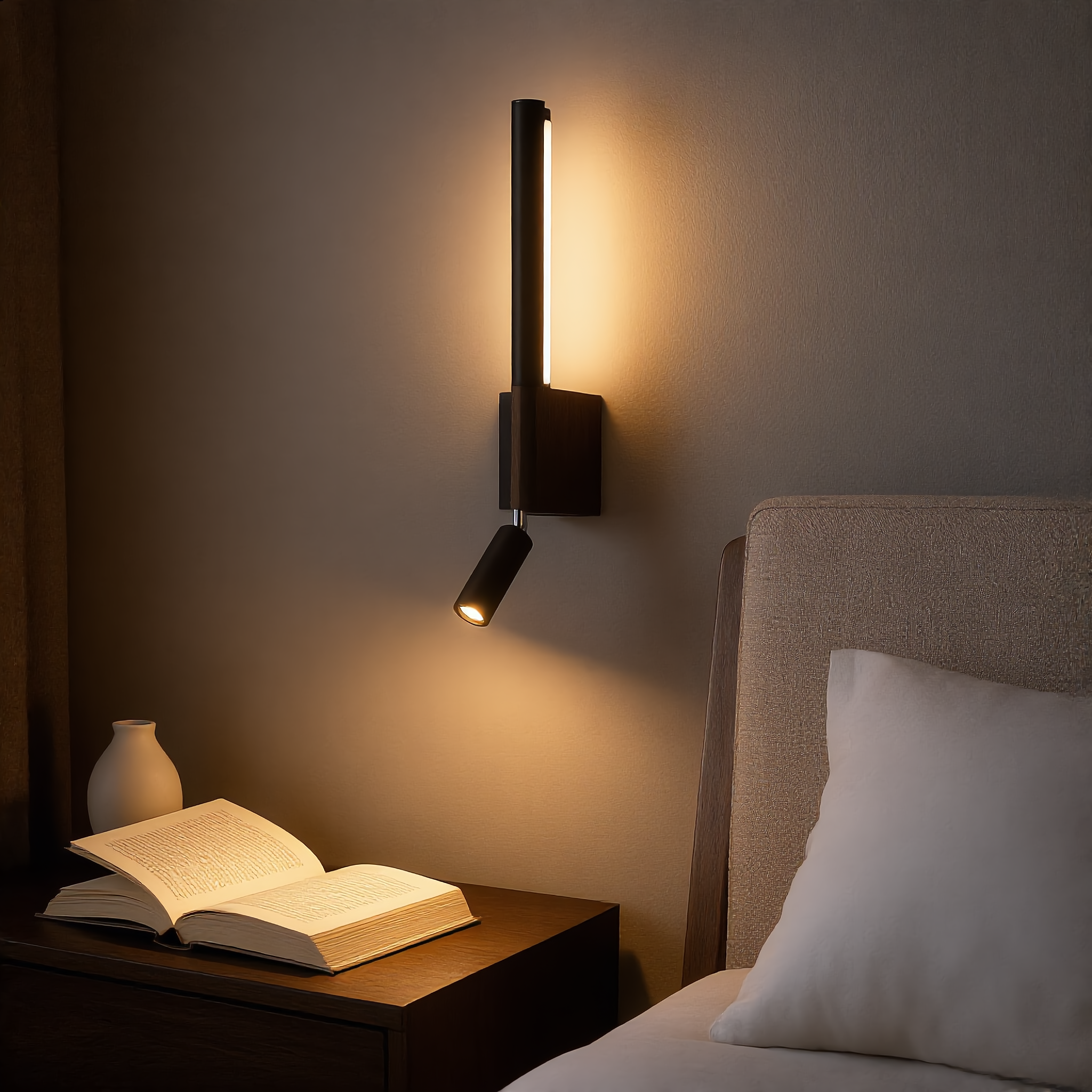 Black Carezza Notturna reading wall light glowing warm in a cozy modern bedroom