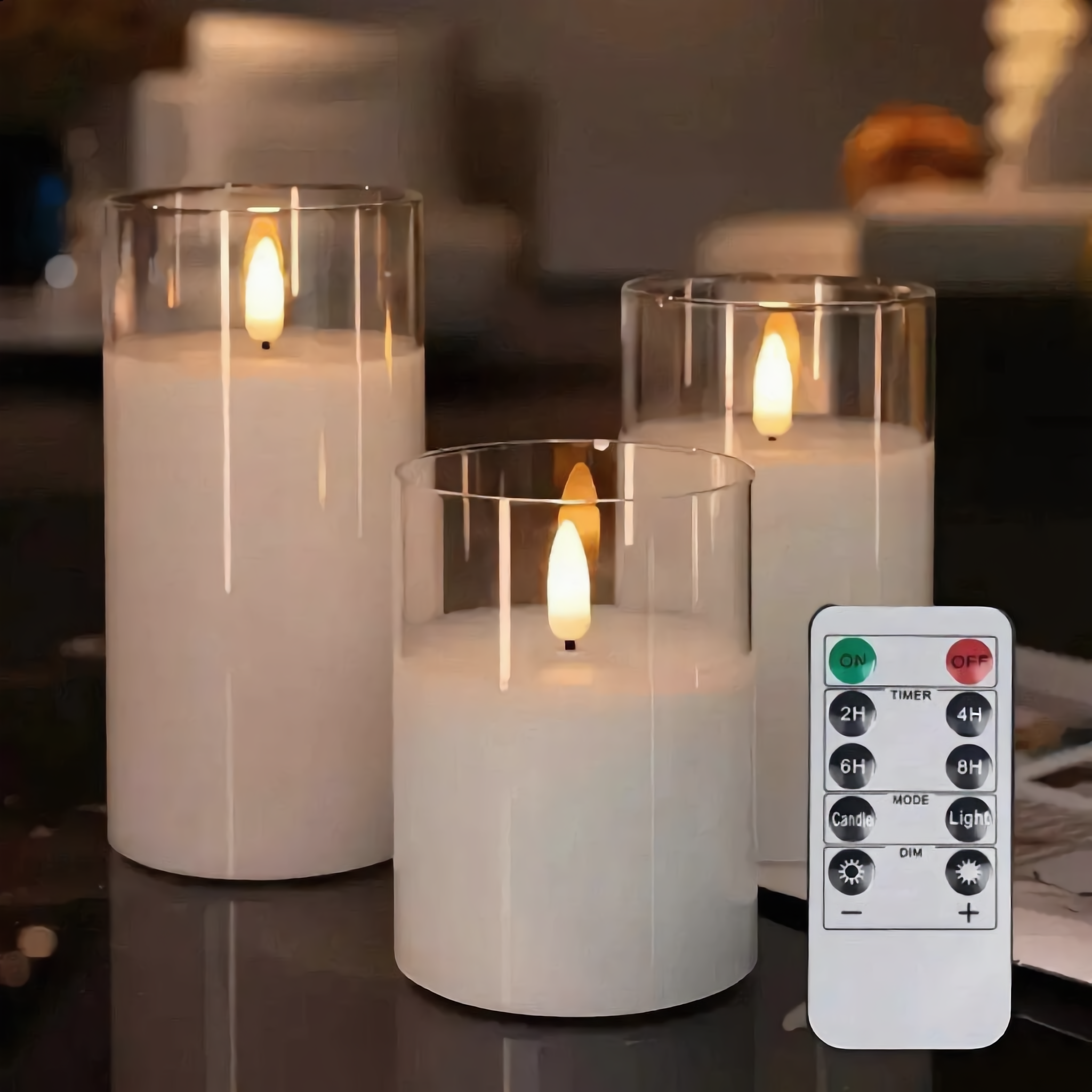 Fiamma Serena flameless candles glowing beside the included remote control with timer