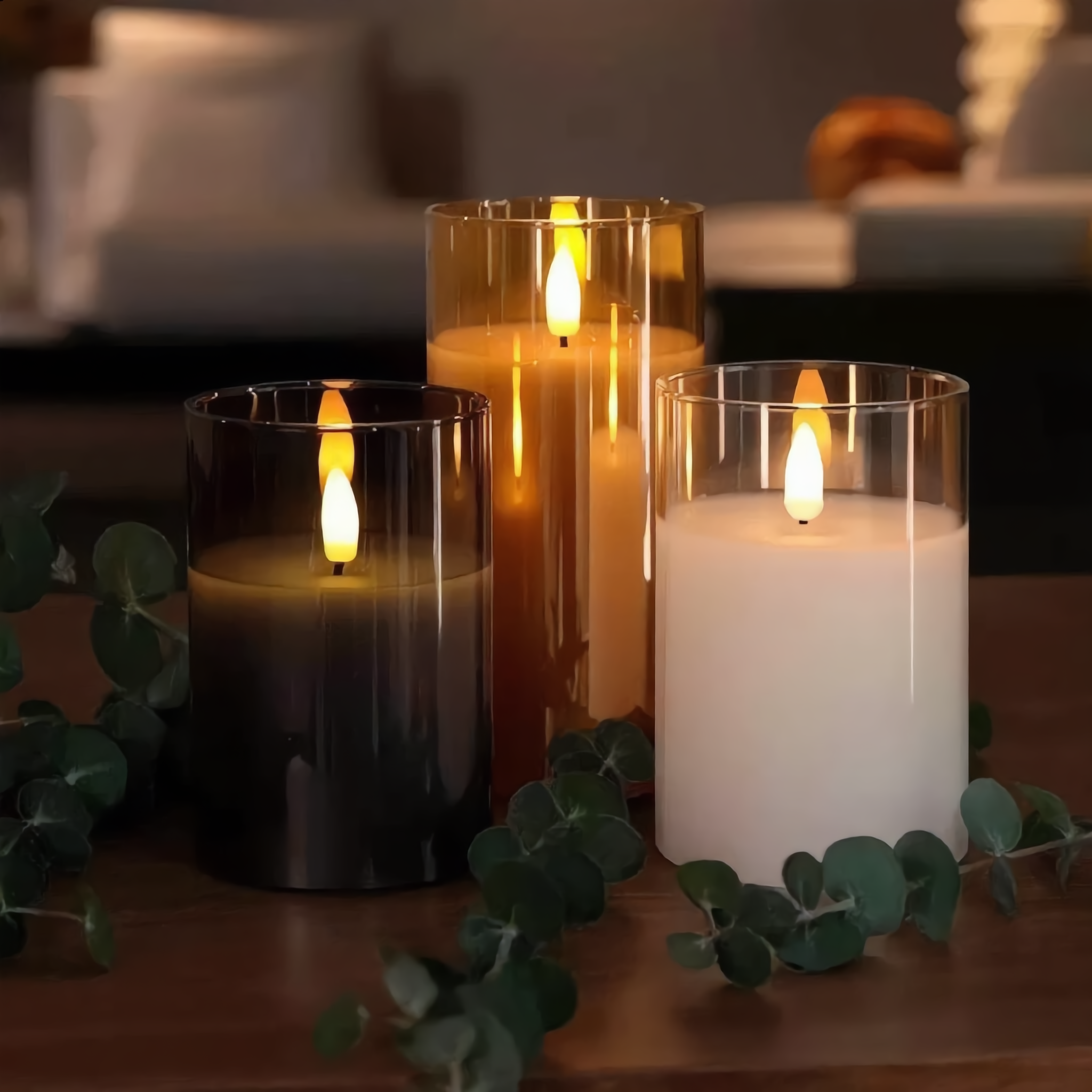 Fiamma Serena flameless candle sets in black, amber, and white glass shown together