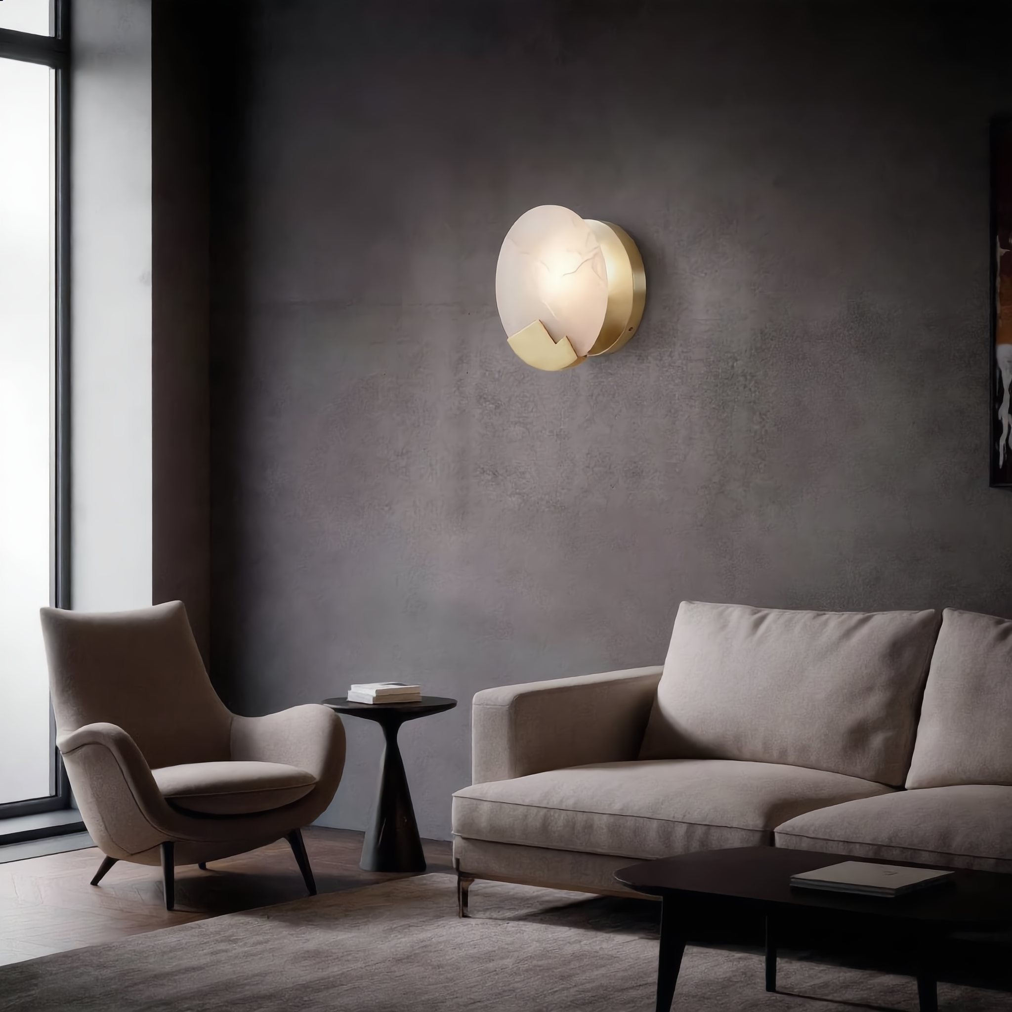 Luna d'Alabastro alabaster wall sconce with a cool white glow on a living-room feature wall