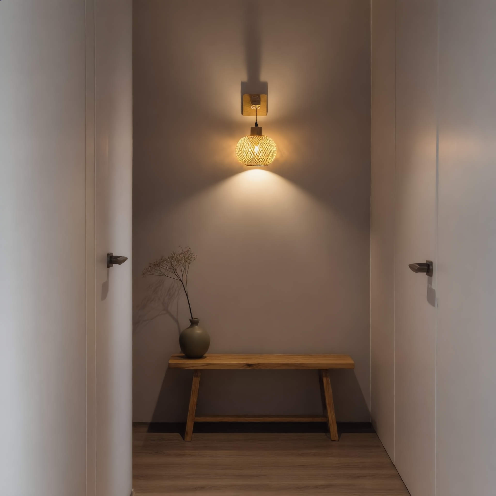 Intreccio rattan wall lamp glowing warm in a serene Japandi hallway