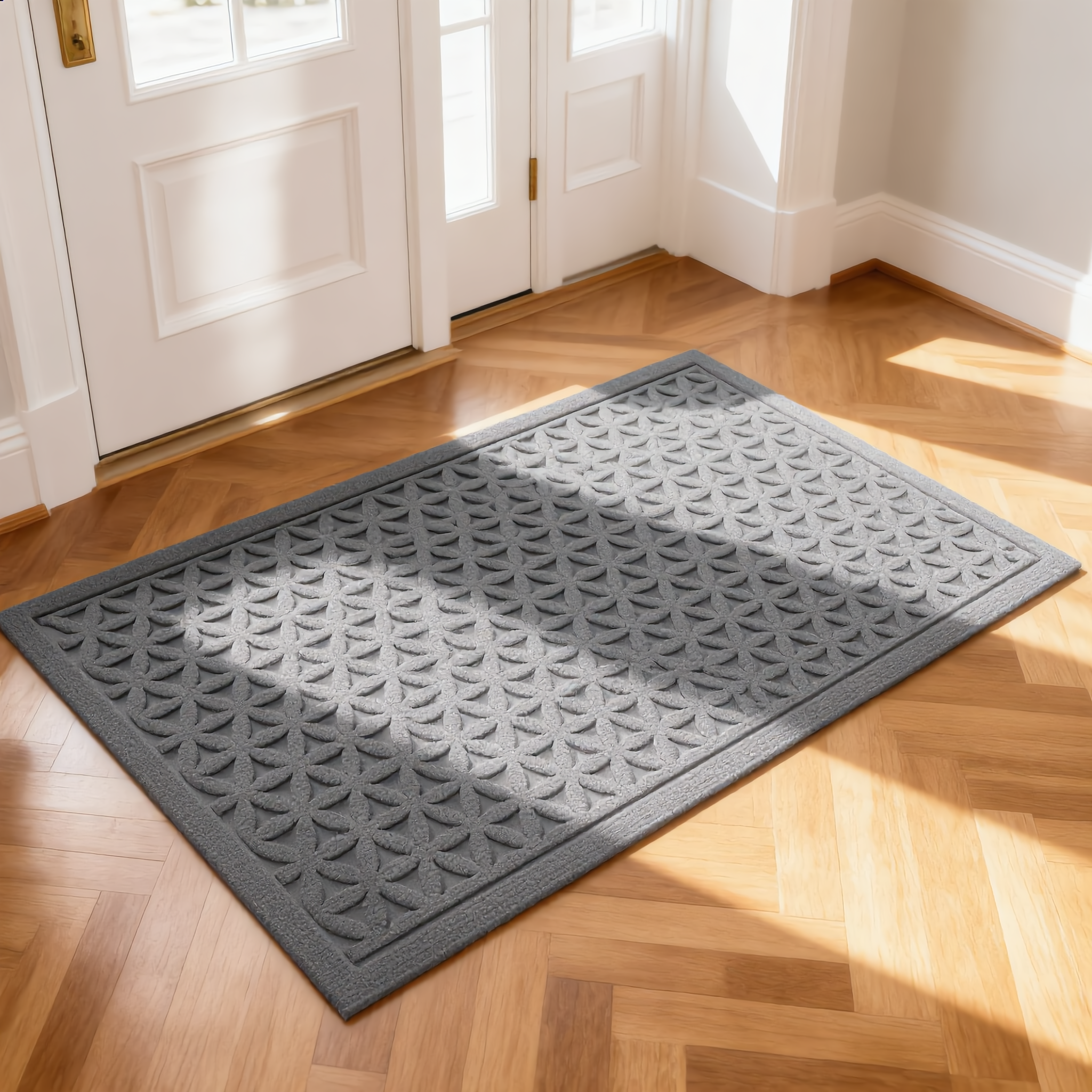 Gray Geometry doormat at a bright white front-door entryway